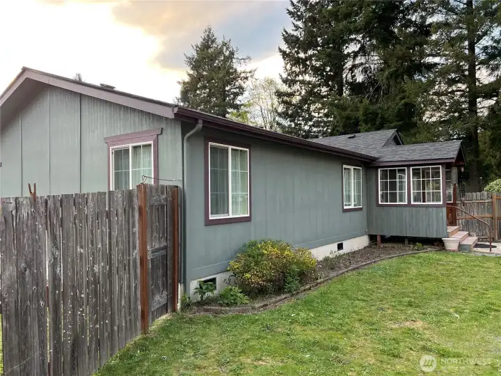 The perimeter of the property is wire fenced, and the home has additional wood fencing to keep in pets, and protect the yard and gardens from the the local dear and elk.