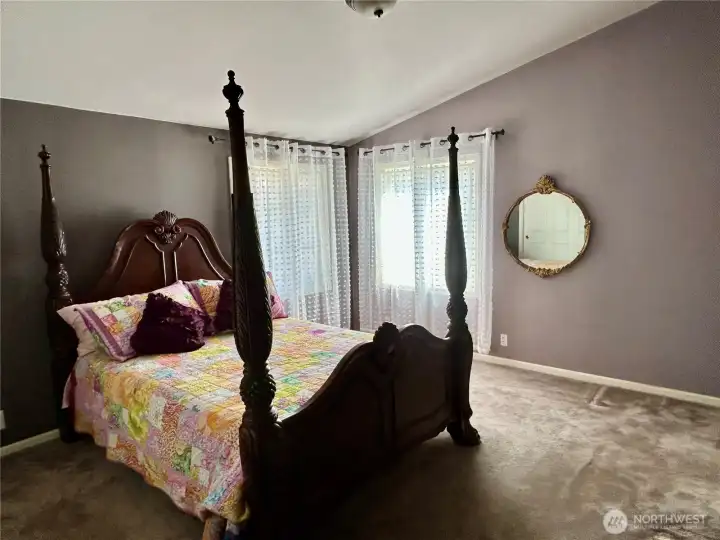 Primary suite with vaulted ceilings