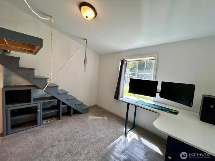 Bedroom number two with stairs to the loft sleeping area.