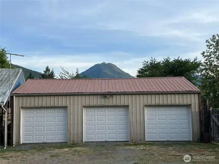 3 new garage doors on this shop with storage loft.