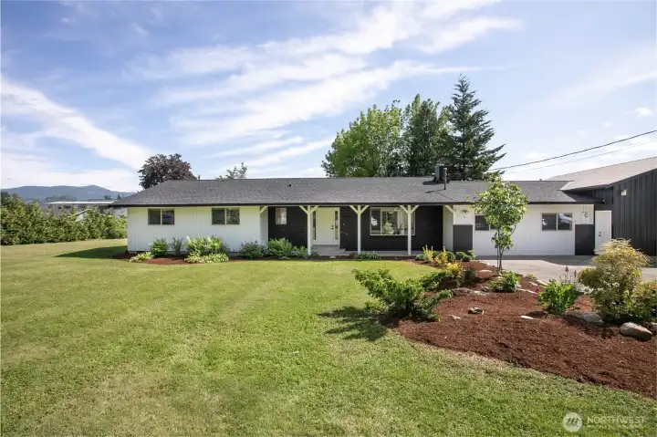 Welcome home! Over 2,000 sq ft home fully remodeled with attached 2 bay shop on .5 acre with new roof!
