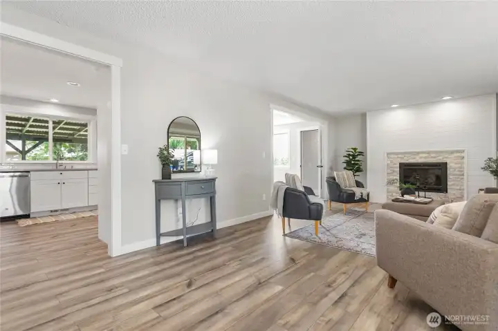 Spacious living room with shiplap cozy gas fireplace
