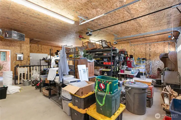 Yes there is a bit of moving to be done, but fits 4 cars 2 bay shop w/double door access to backyard. Heated and 3/4 bathroom installed