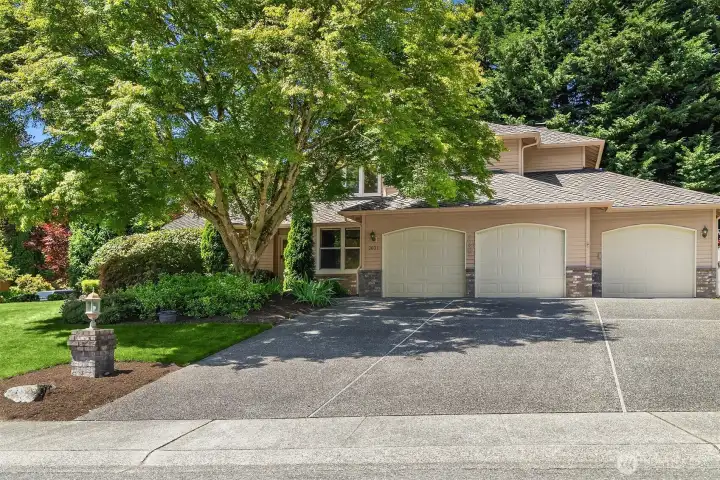 A beautiful corner lot with mature and lush landscaping