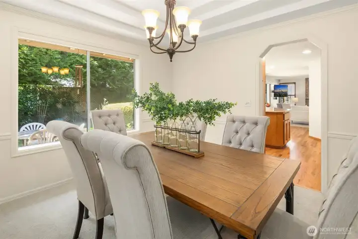 This nice dining area looks out into the backyard, and easy access into the kitchen