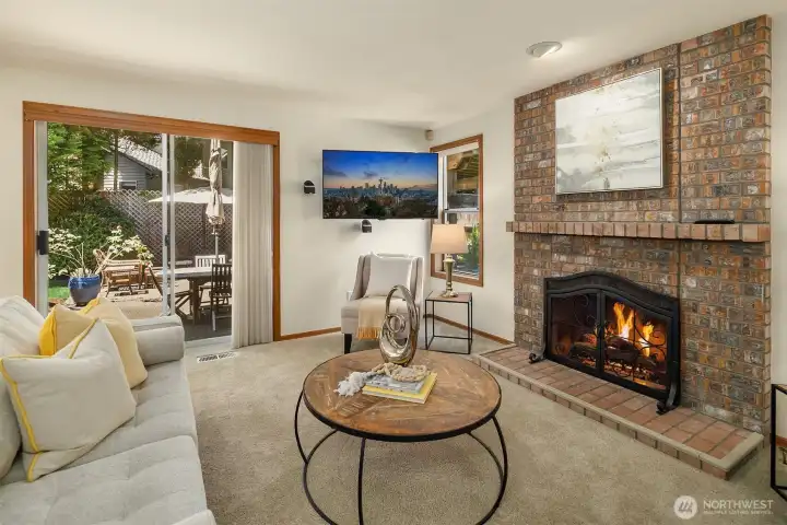 The Family Room with slider doors leading outside to the backyard & patio area