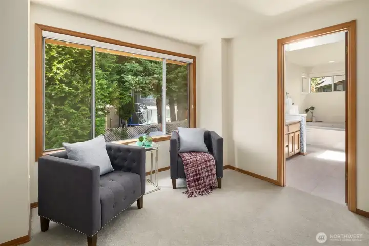 The sitting area in the Primary Bedroom & nice size bathroom