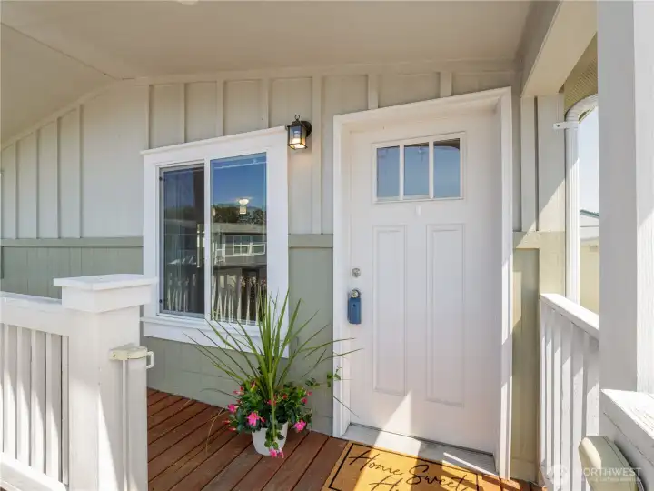 Step into your new home. The front porch is equipped with a rolling doggy door to keep your furry friend safe and contained.