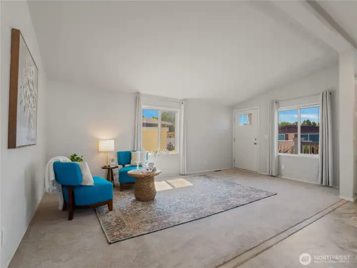 The spacious living room allows for a multitude of configurations and furniture placements.