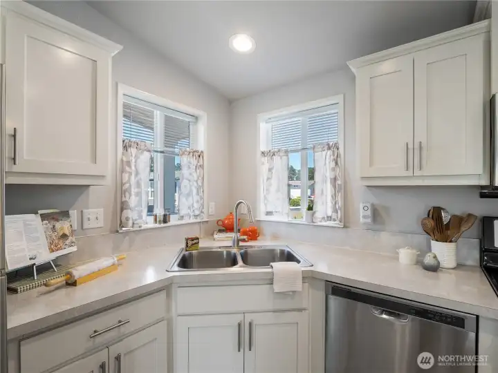 This kitchen has stainless steel appliances.