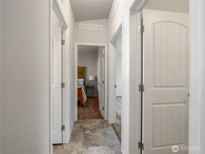 The kitchen, hallway, bathroom has tasteful vinyl flooring.