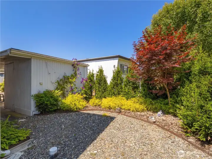 The side yard has a private area that is perfect to place a sitting area and enjoy a beverage in the sun.