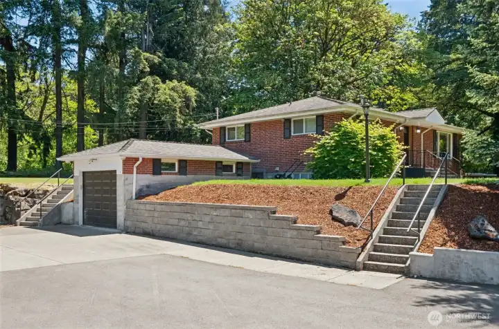 Home looking South including single car attached garage