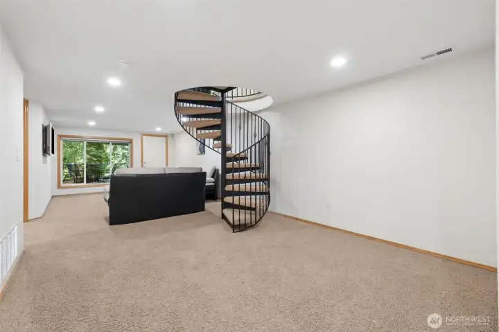 Downstairs living room and spiral staircase