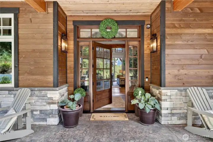 Idyllic covered porch entry opens to this 4 bed/4 bath home.