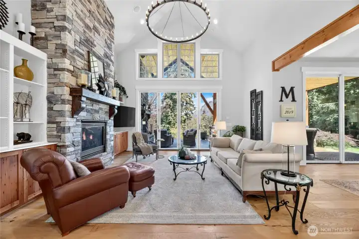Vaulted ceilings and floor to ceiling stone fireplace set the mood.