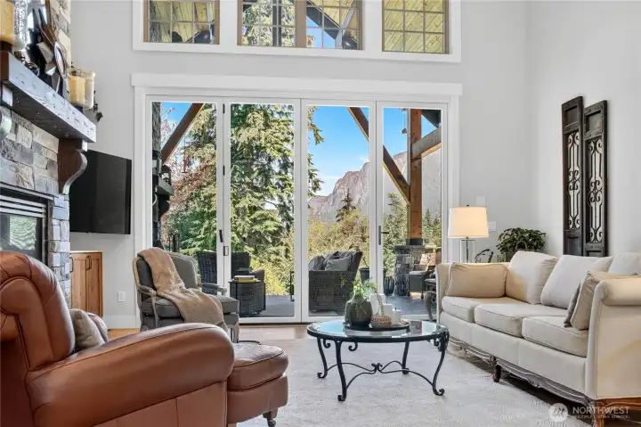 Ease of indoor/outdoor living through a wall of opening glass doors.