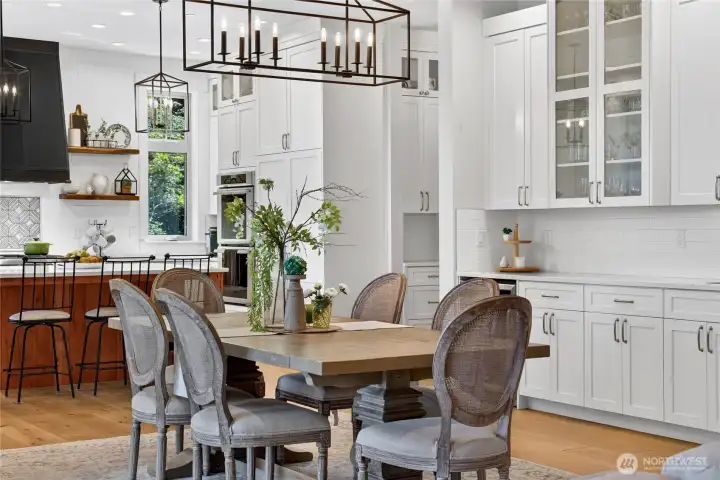 Extra cabinetry and serving buffet with beverage refrigerator.