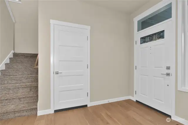 Similar home, not actual. Welcoming wide entry way with hardwood flooring.