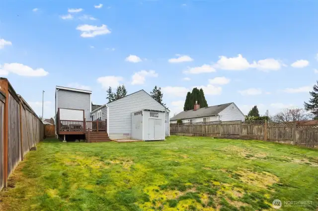 Additional storage shed sits confidently in the backyard.