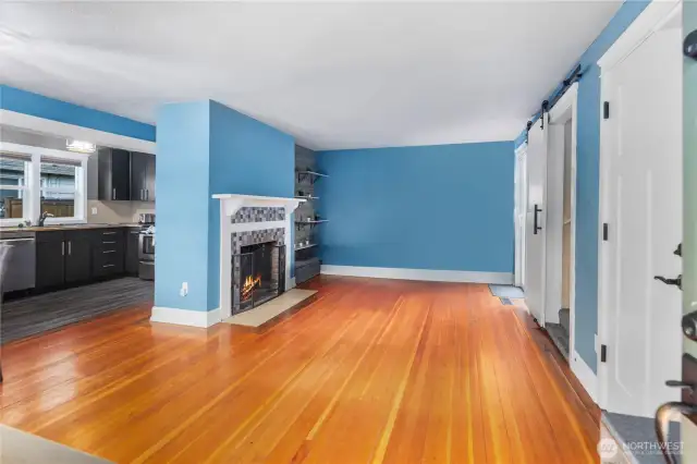 You will be greeted with cozy hardwoods, a spacious living area and wood-burning fireplace.