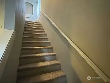 Stairs to Loft: Ascend to Flexible Living Space.