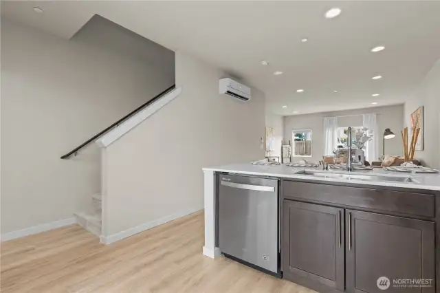 Full length view of main living floor and stairs to leading up to the bedrooms.