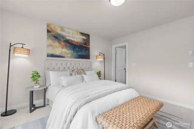 Spacious primary bedroom with peaceful natural light.