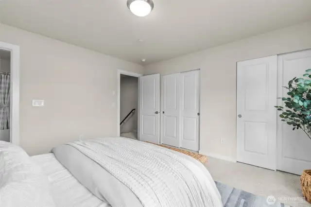 Spacious primary bedroom with peaceful natural light.