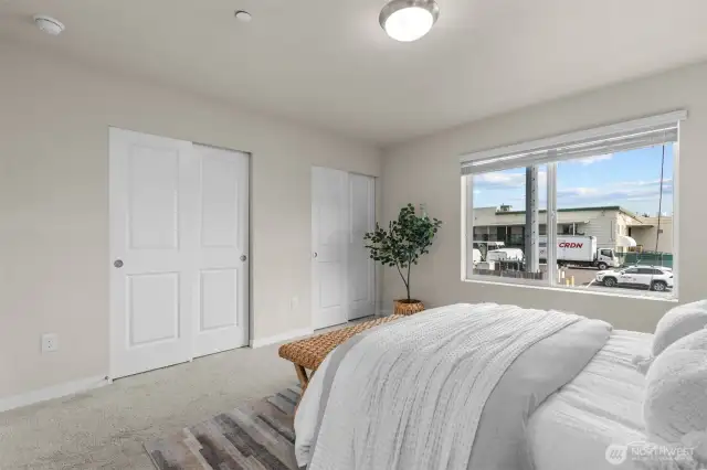 Spacious primary bedroom with peaceful natural light.