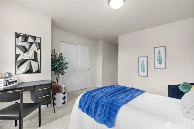 Well-sized second bedroom with plush carpet and make sure to catch the tranquil view of the mountains.