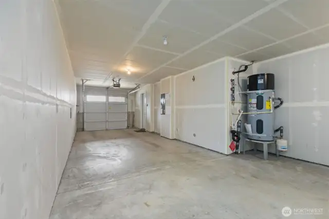 Attached two-car tandem garage with ample storage space and access to the interior and back patio
