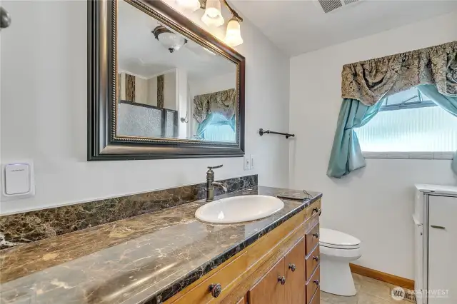 Hall bath with beautiful countertops.