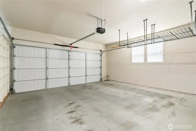 2 car garage, with window and additional overhang storage racks. Plenty of room for projects!