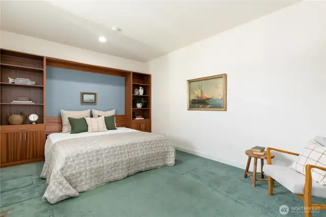 In 2012, the Den was extended an additional 80sqft (permitted and inspected) and a custom built-in with king size murphy bed was installed. Not shown is when the murphy bed is folded into built-in, it features a pull out table/desk as well. This space seamlessly transitions for mixed use!