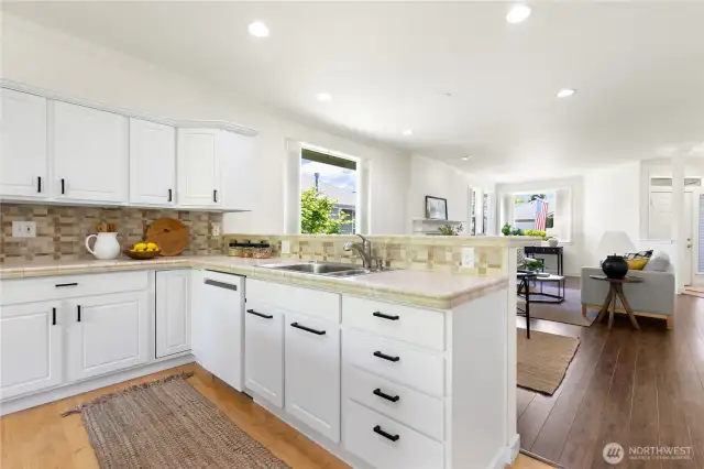 Upgraded custom eat-in bar with additional cabinet storage underneath!
