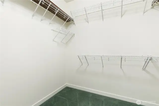 Primary suite's roomy walk-in closet.