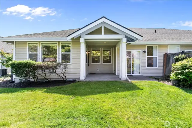 large back patios off the kitchen - perfect for relaxing and enjoying the mature gardens and greenery!