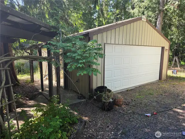 The detached garage with paved walkway