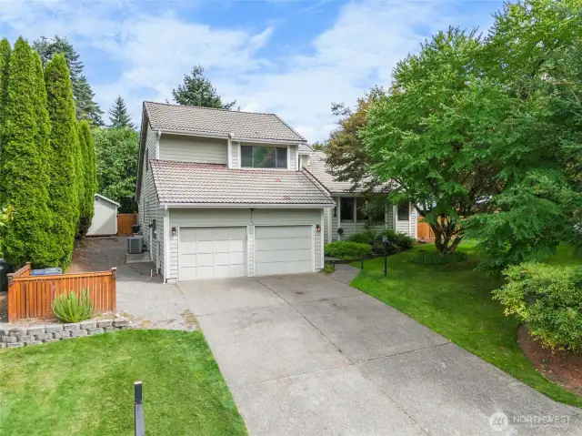 Tile roof! Well manicured yard. Extended driveway. Just wait to see inside!