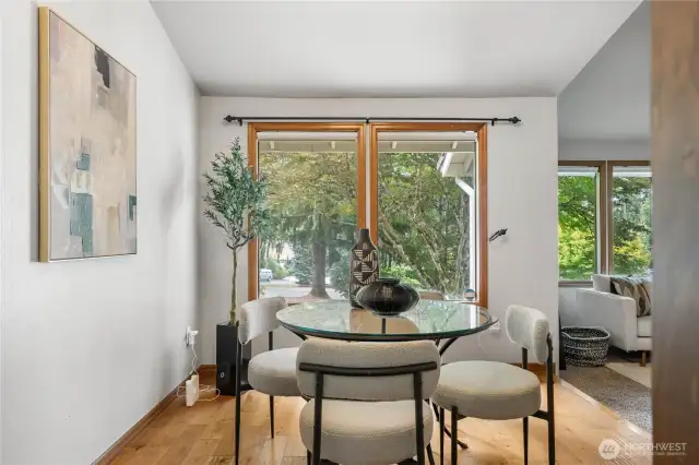 Cute dining room with engineered hardwood floors.