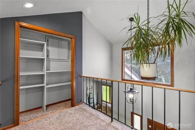 Upstairs landing with access to tons of attic storage.