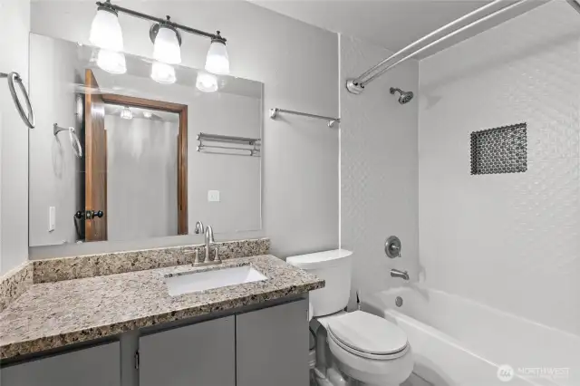 Upstairs full bathroom, fully updated with floor to ceiling tile