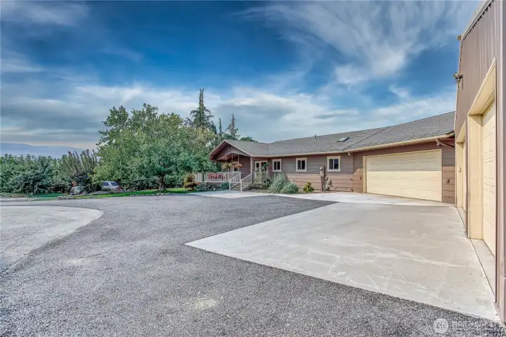Parking area and view of front of home looking West