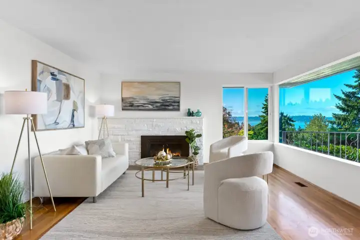 Hardwood floors, a wood burning fireplace and extraordinary views enhance this room.