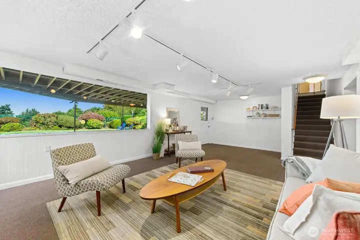 Back door opens to a covered patio and level yard with mature landscaping. Very private!