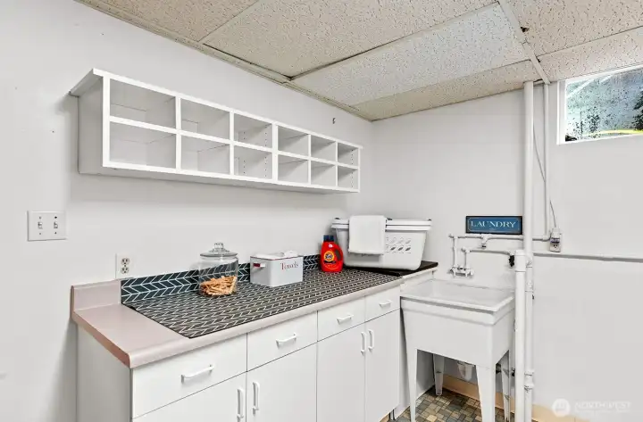 Laundry sink and counter space.