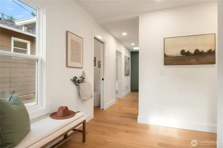 The gracious formal entry features an ample greeting area with new engineered flooring and a nice sized coat closet.