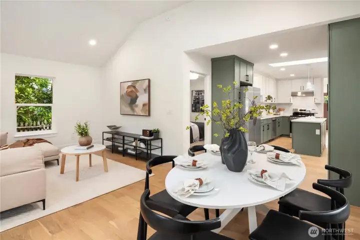 The kitchen flows into the great room with soaring vaulted ceilings.