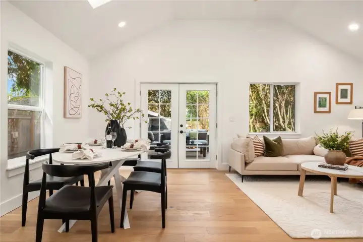 The spacious dining area can easily accommodate the largest of dinner parties. The french doors flow out onto the new composite deck and paver patio.